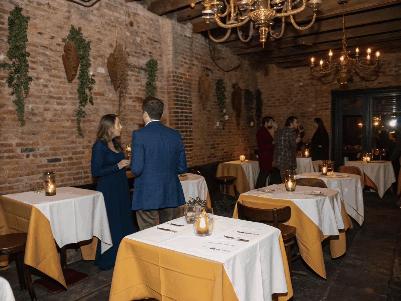 Modern Italian restaurant interior with leather booths and warm lighting